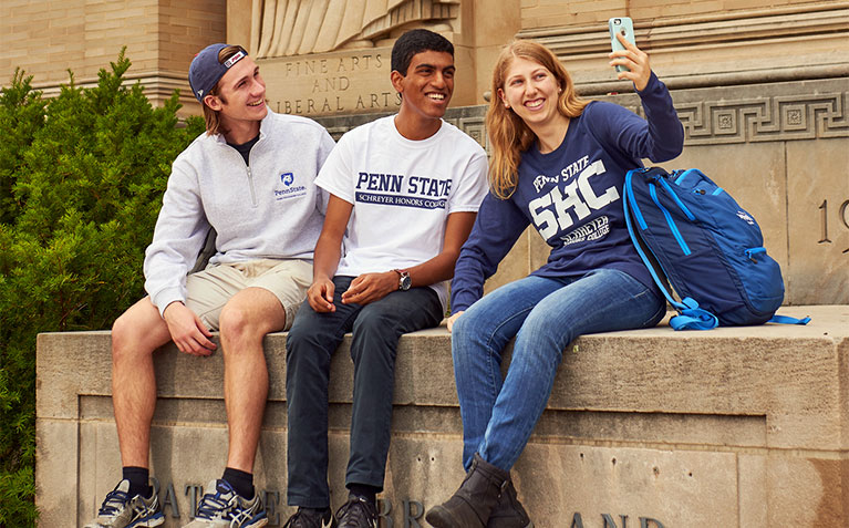 Three Scholars taking a selfie at Paterno and Pattee Libraries